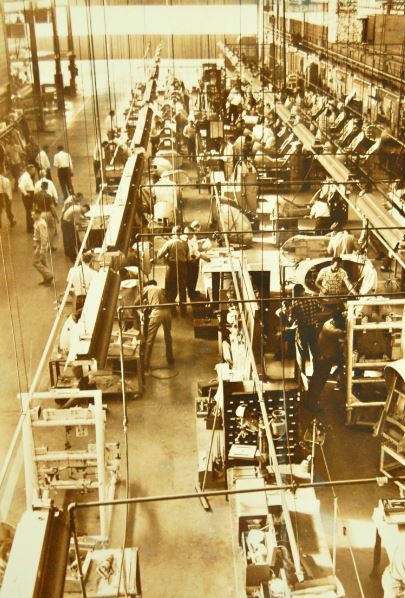 Historic photo showing workers at the Stanley Aviation complex.